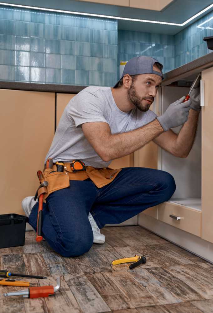 Handyman making repairs to kitchen counter